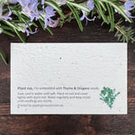 Seed paper card with herb seeds on a wooden surface.