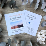 Seed paper memorial cards for ‘Celebrating of life service' with a small landscape photo and memorial quote.